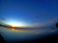 Calm blue sunset sky over the lake, calm surface of water, lake Uvildy, Fisheye