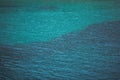 Calm blue turquoise ocean surface. Background texture. Close up mediterranean sea wave. Royalty Free Stock Photo