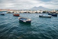 Calm blue Tyrrhenian Sea. View from the embankment of Naples to Mount Vesuvius volcano. Pleasure boats moored near the shore and Royalty Free Stock Photo