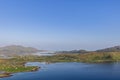 Calm blue waters wind through green areas and small villages in Norway\'s peaceful Lofoten