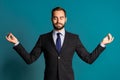 Calm businessman in suit relaxing, meditating. Handsome european man calms down