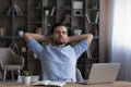 Calm businessman leaning back in office chair during break Royalty Free Stock Photo