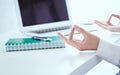 Calm businesswoman meditating at work, focus on female hands in mudra, close up view. Peaceful mindful employee Royalty Free Stock Photo