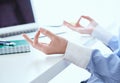 Calm businesswoman meditating at work, focus on female hands in mudra, close up view. Peaceful mindful employee Royalty Free Stock Photo