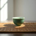 Single Green Tea Cup on Bamboo Mat Royalty Free Stock Photo