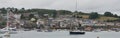 Moored boats yachts, sailing boats, cruisers, lifeboat, dinghies in front of the quayside and buildings in Salcombe, Devon UK Royalty Free Stock Photo