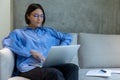 Focused female freelancer working on the laptop