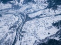 Calm and cosy fairy-tale village Kryvorivnia covered with snow in the Carpathians mountains, aerial view. Typical landscape in