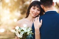 Calm, couple and love at sunset with wedding on hand of bride with flowers, bouquet or marriage. Loyalty, commitment and Royalty Free Stock Photo