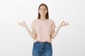 Calm down, day will be amazing. Relaxed beautiful caucasian girl in pink t-shirt, standing with closed eyes, smiling Royalty Free Stock Photo