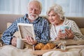 Calm elderly husband and wife having rest at home Royalty Free Stock Photo