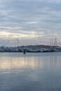 Calm european evening near the river under the sky with many clouds Royalty Free Stock Photo