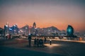 Calm evening ambiance as people enjoy the city waterfront. Jan 12 2024