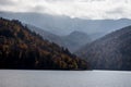 A calm evening landscape with lake and mountains. Amazing view of the Goy-Gol (Blue Lake) Lake among colorful fall forest at Ganja