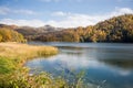 A calm evening landscape with lake and mountains. Amazing view of the Goy-Gol (Blue Lake) Lake among colorful fall forest at Ganja