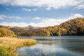A calm evening landscape with lake and mountains. Amazing view of the Goy-Gol (Blue Lake) Lake among colorful fall forest at Ganja