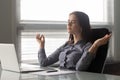 Calm female office employee meditating at workplace Royalty Free Stock Photo