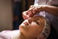 Calm girl having spa facial massage in luxurious beauty salon