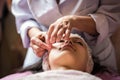 Calm girl having spa facial massage in luxurious beauty salon