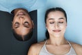 Calm glad young arabic, african american women with closed eyes practice yoga, breathing exercises on black and white