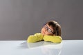 Calm happy child sleeping on desk to meditate for idea