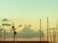 Calm harbor scene vintage lamp and ship masts sunset Royalty Free Stock Photo