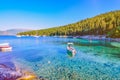 Calm and idyllic Beach of Foki Fiskardo with crystal clear and transparent water, Kefalonia, Ionian islands, Greece Royalty Free Stock Photo