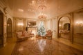 Calm image of interior Classic New Year Tree decorated in a room with fireplace