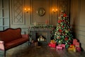 Calm image of interior Classic New Year Tree decorated in a room with fireplace