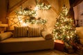 Calm image of interior modern home living room decorated christmas tree and gifts, sofa, table covered with blanket. Royalty Free Stock Photo