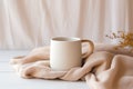 Plain white blank mug cup, beige neutral rustric cottagecore, on beige linen, product display Royalty Free Stock Photo