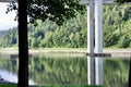 Calm lake in the mountain with tree reflection on water surface Royalty Free Stock Photo