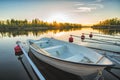 Calm Lake with Reeds at Sunrise, Fishing Boat Tied to Wooden Pier Royalty Free Stock Photo