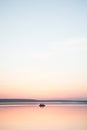 Calm lake sunset boat couple minimalism Royalty Free Stock Photo