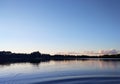 Lake surface at evening in Latvia, East Europe. Landscape with water and forest. Royalty Free Stock Photo