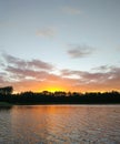 Lake surface at evening in Latvia, East Europe. Landscape with water and forest. Royalty Free Stock Photo