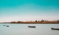 Calm lake with two fishing boats. Fresh water lagoon in Estany de cullera. Valencia, Spain Royalty Free Stock Photo