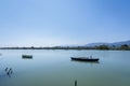 Calm lake with two fishing boats. Fresh water lagoon in Estany de cullera. Valencia, Spain Royalty Free Stock Photo
