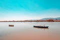 Calm lake with two fishing boats. Fresh water lagoon in Estany de cullera. Valencia, Spain Royalty Free Stock Photo