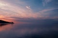 Calm landscape, sea, sky, reflections, pink and orange sunset Royalty Free Stock Photo