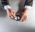 Calm male manager hands ringing a bell for customer help Royalty Free Stock Photo