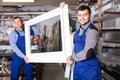 calm male professional labours with finished PVC profiles and windows Royalty Free Stock Photo