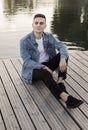 Calm man resting on wooden pier Royalty Free Stock Photo