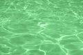 Calm mint colored clear shiny water surface