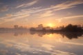 Calm misty sunrise over wild lake