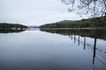 Calm moody evening landscape over Coniston Water in English Lake