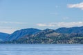 Calm morning lake in British Columbia Canada blue sky with white clouds Royalty Free Stock Photo