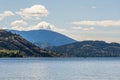 Calm morning lake in British Columbia Canada blue sky with white clouds Royalty Free Stock Photo