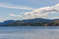 Calm morning lake in British Columbia Canada blue sky with white clouds Royalty Free Stock Photo