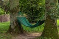 calm nature with hammock between trees peaceful summer day time with clean environment space without people